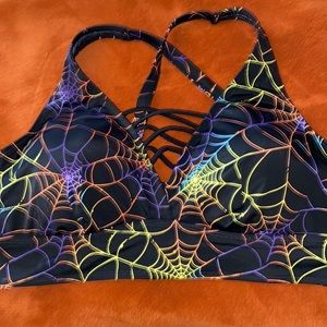 NWT Torrid black with rainbow web bikini top. Size 2.